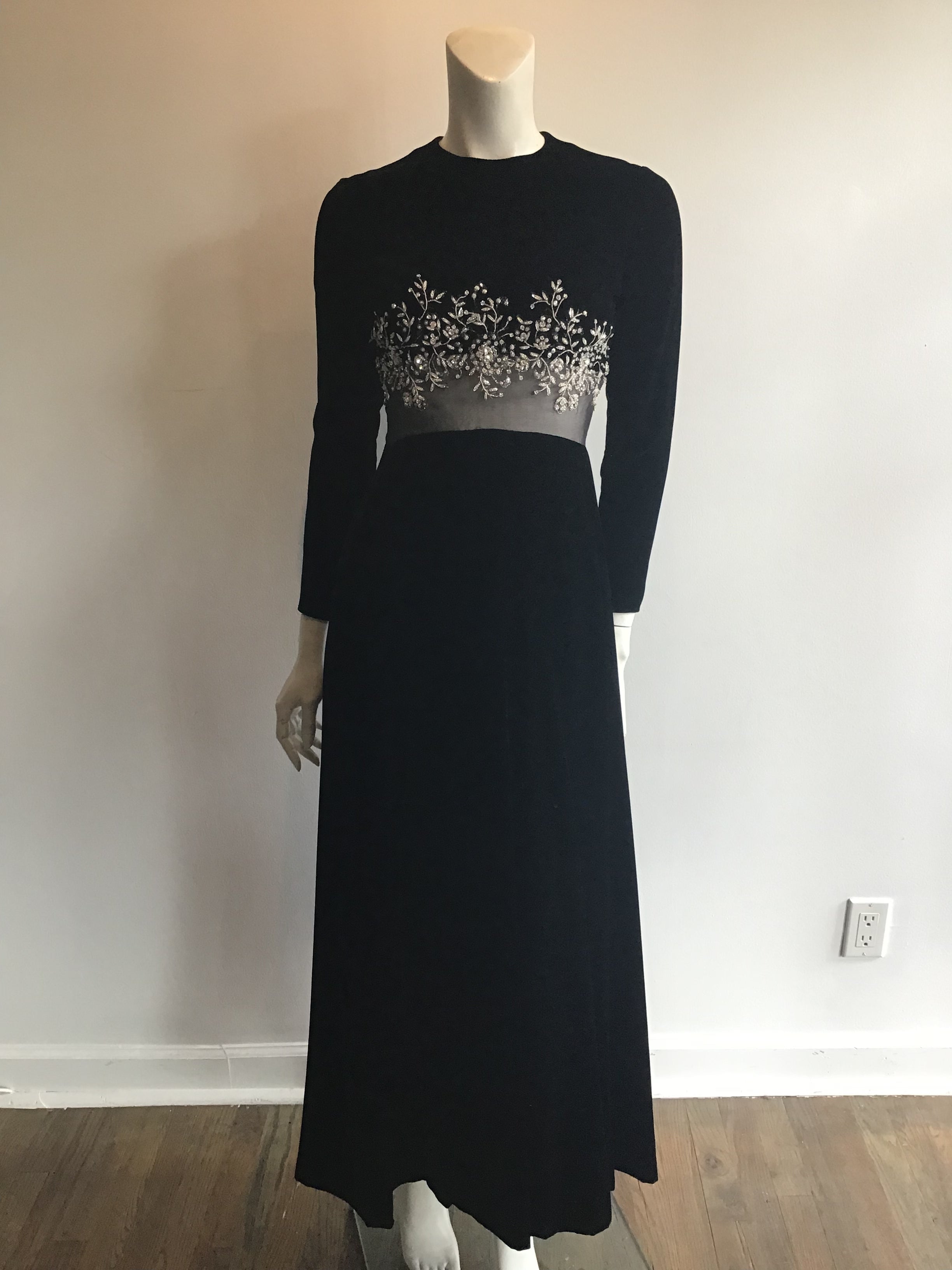 1960s Malcolm Starr Black silk velvet evening dress with rhinestone and crystal detailing on bodice, illusion waist. Mint condition appears unworn