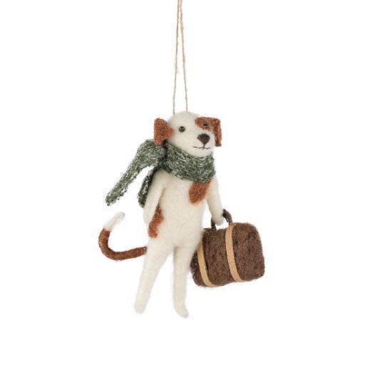 Dog ornament with a green scarf and brown suitcase background