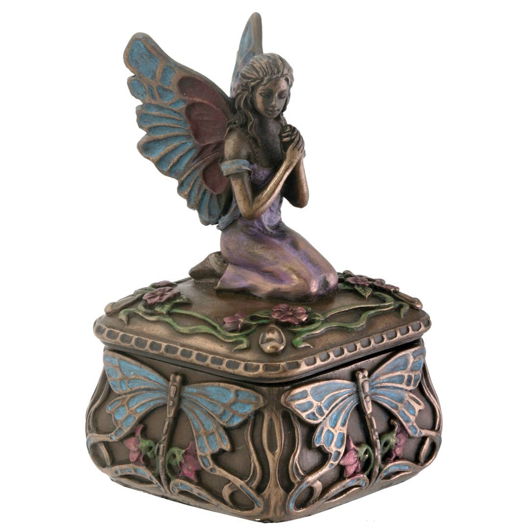 Decorative box with a fairy and butterfly design on a white background
