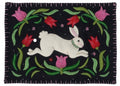 Embroidered patch with a white rabbit and flowers on a black background