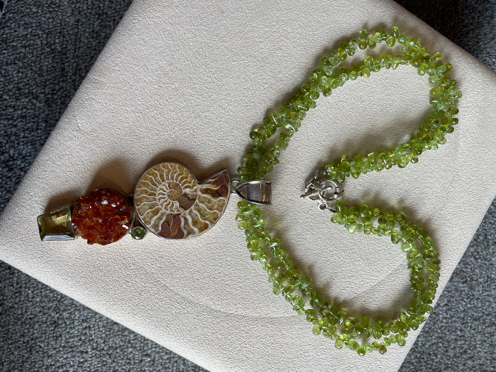Multistrand Green Peridot , Citrine, nautilus fossill and and crystal necklace
