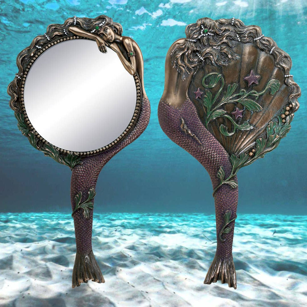Decorative hand mirror with mermaid 


