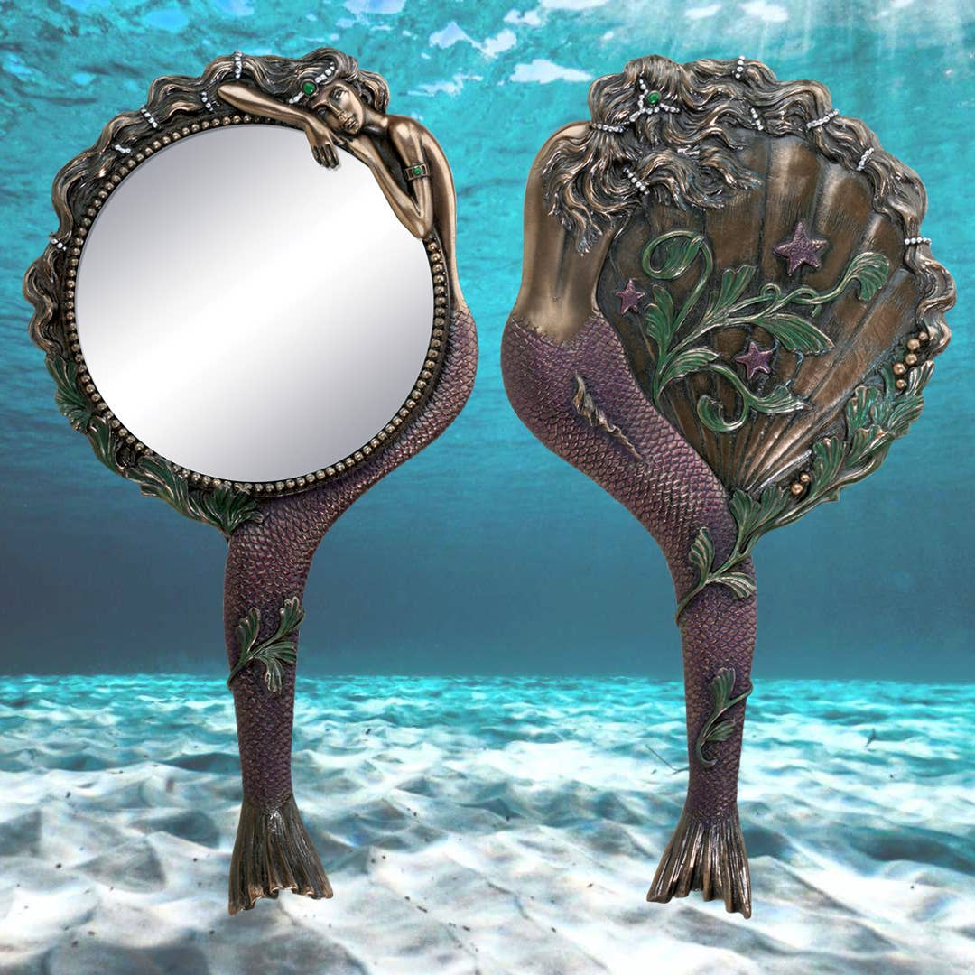 Decorative hand mirror with mermaid 

