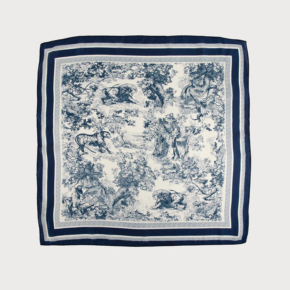 Navy blue and white patterned scarf with animal designs 
