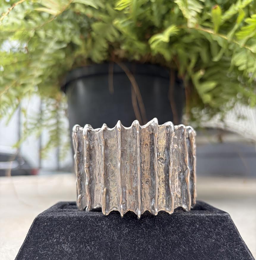 A wide, textured silver cuff